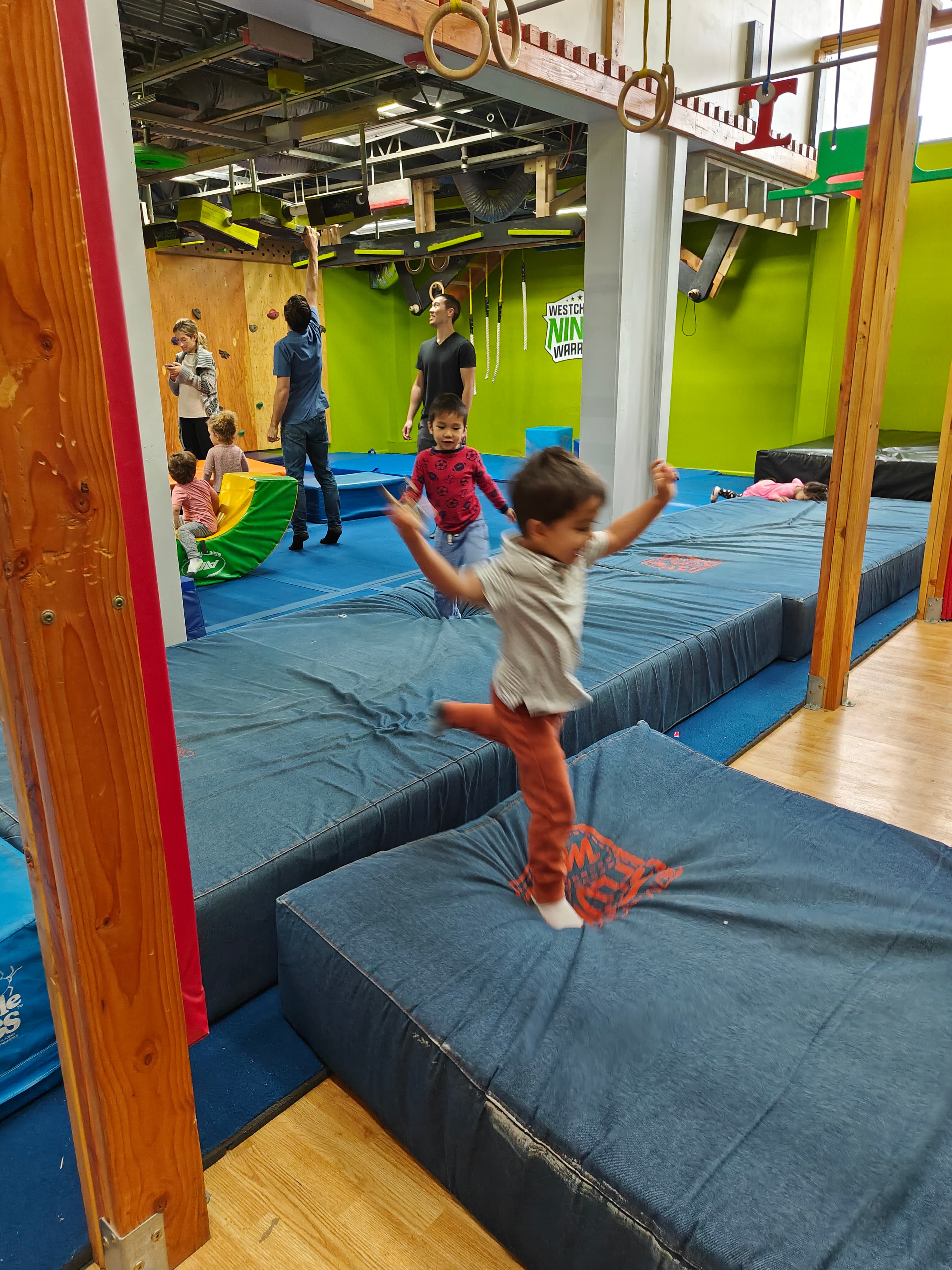 Young children playing on the Ninja course